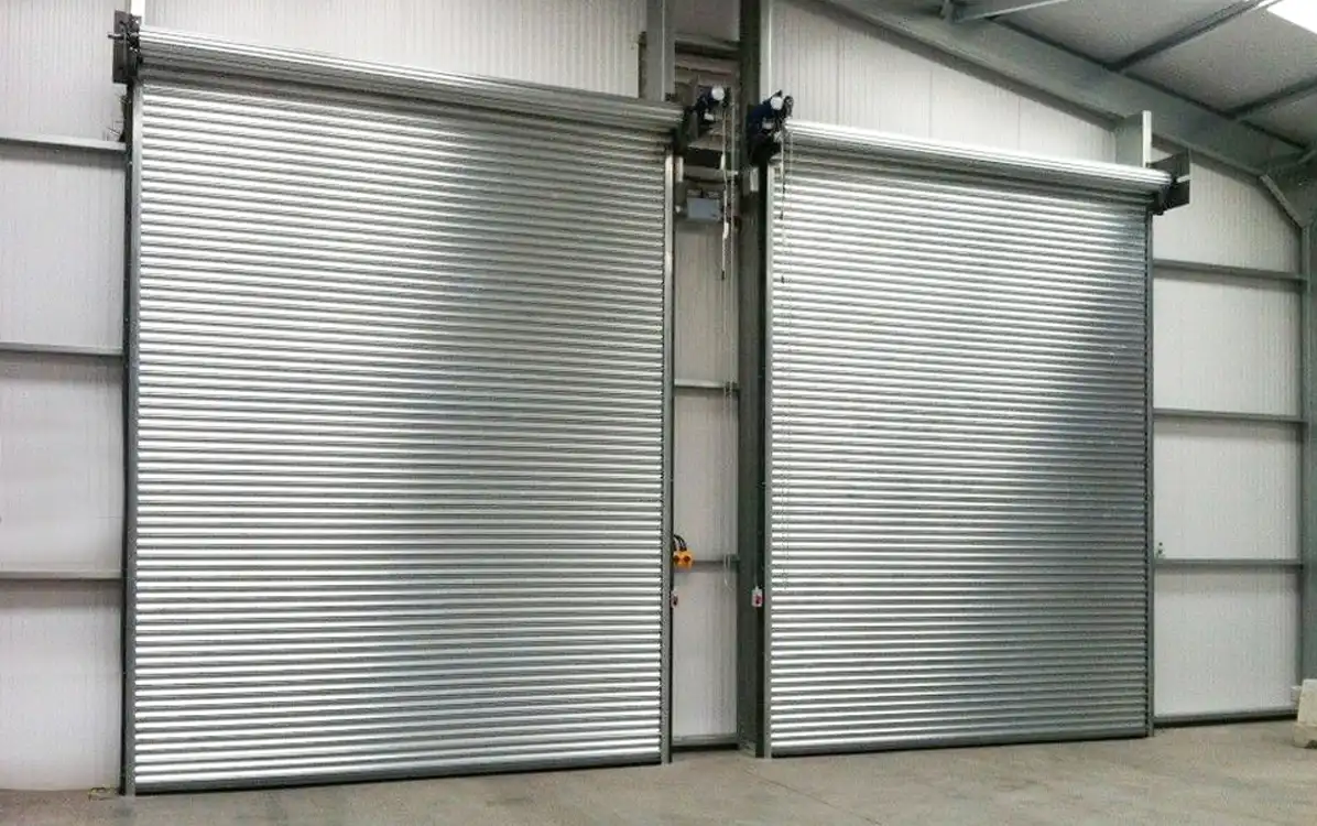 Pair of Titan industrial roller shutter doors in steel building