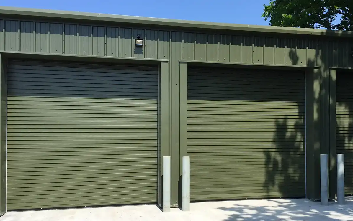 Row of Ganymede insulated roller shutter doors on steel building